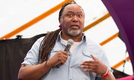 Reginald D Hunter speaking into a microphone on a stage in 2021 Reginald D Hunter speaking into a microphone on a stage in 2021