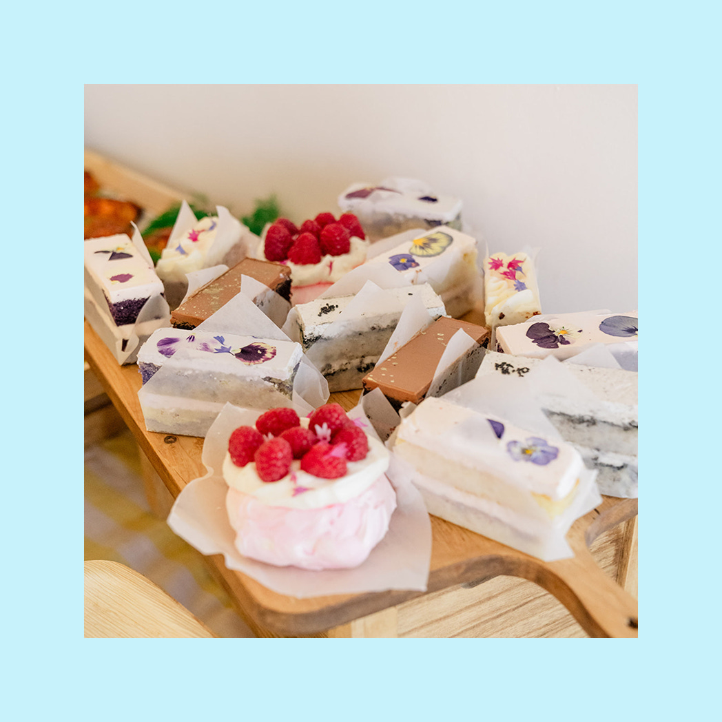 A photo of a charcuterie board with different pastries and cakes on it.