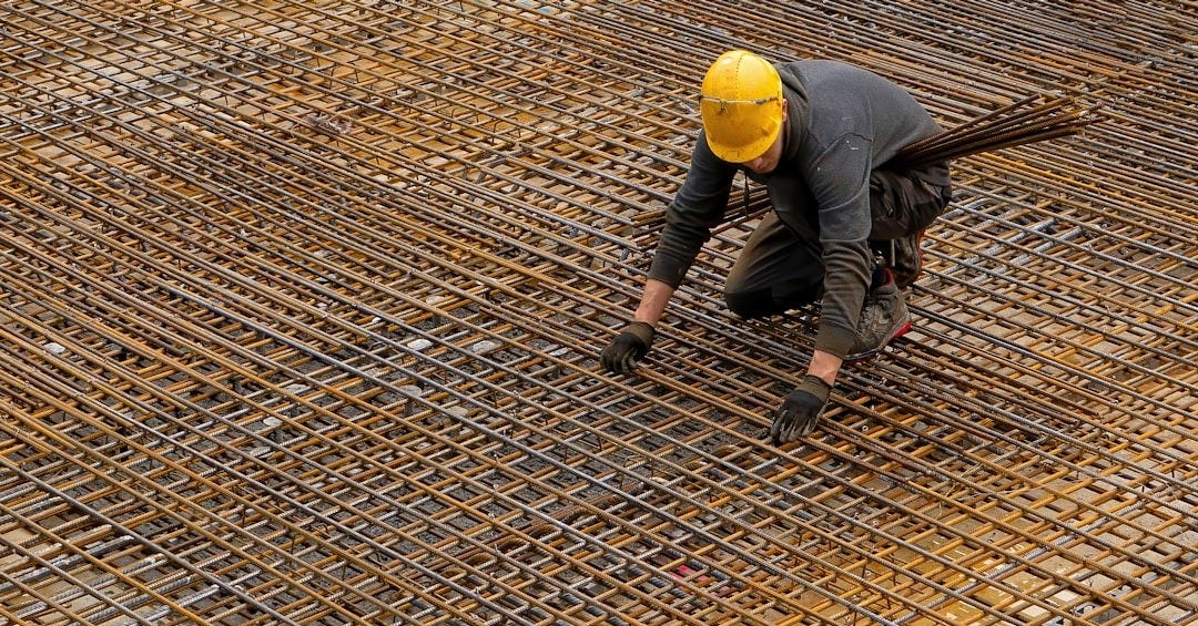 man in black jacket and yellow helmet man in black jacket and yellow helmet