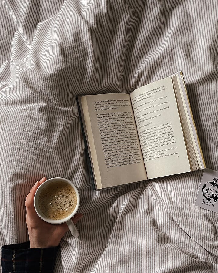 Image 1: A cosy moment in bed—coffee in hand, book resting nearby (And the Stones Cry Out by Clara Dupont-Monod), waiting to be opened. / Image 2: The book is now open, coffee still in hand—ready to dive in.