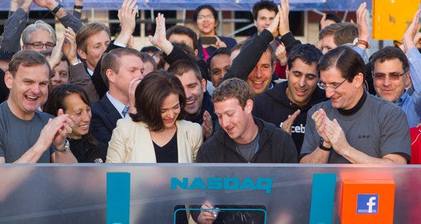 Mark Zuckerberg, center, rang the Nasdaq opening bell remotely from Facebook’s campus in Menlo Park, Calif. Mark Zuckerberg, center, rang the Nasdaq opening bell remotely from Facebook’s campus in Menlo Park, Calif.
