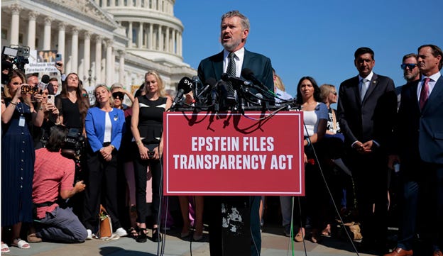 A person standing at a podium with microphones and a sign

AI-generated content may be incorrect.