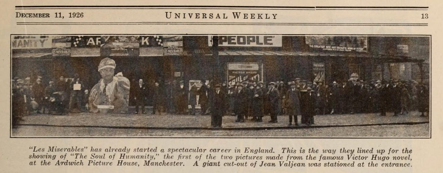 A newspaper clipping from Universal Weekly from December 11 1926 with a photo of a long queue of people outside a cinema, with a giant carboard cut-out of Jean Valjean A newspaper clipping from Universal Weekly from December 11 1926 with a photo of a long queue of people outside a cinema, with a giant carboard cut-out of Jean Valjean