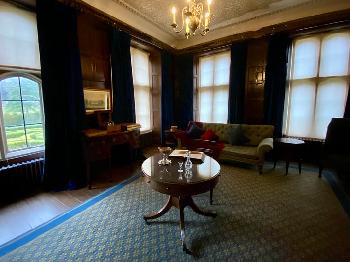 Images from top to bottom, left to right: Byron's four poster bed draped in pale green and topped with gold coronets; A display about his fame featuring a portrait of Byron, a miniature book of his poetry, and an impression of his seal in red wax; His study with dark red wood walls, a blue and yellow carpet with celandine-like flowers, a round table in the centre; ‘Edward III Room’, so named because the king visited Newstead Priory twice, with more dark red wood and hangings – this last was the bedroom of Byron the poet’s predecessor, the 5th Lord Byron, known as the ‘Wicked Lord’.