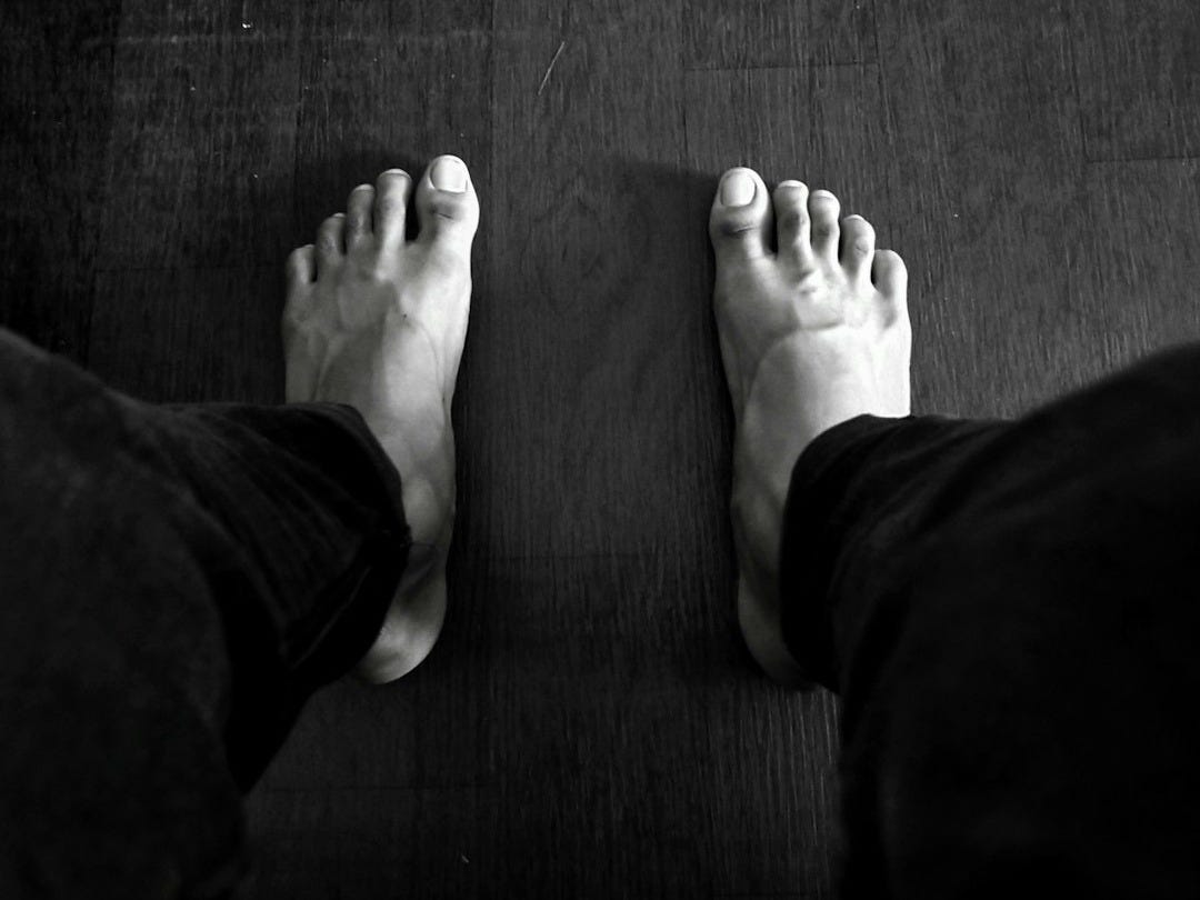 grayscale photography of person wearing pants