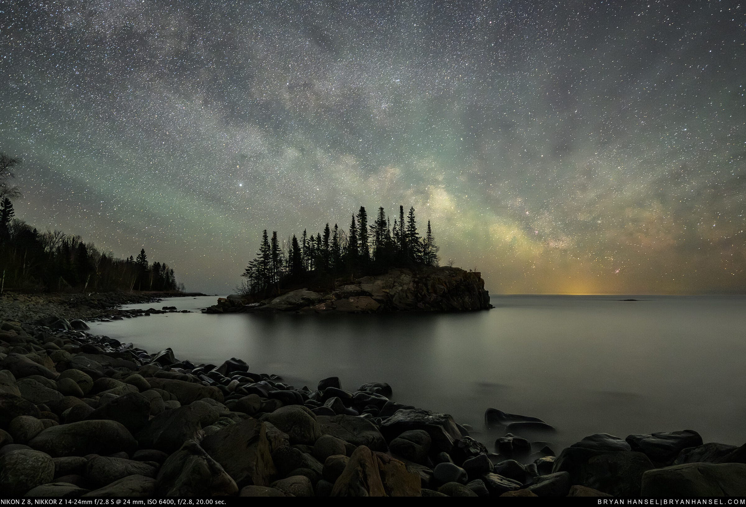 A small tree-covered island under the Milky Way A small tree-covered island under the Milky Way