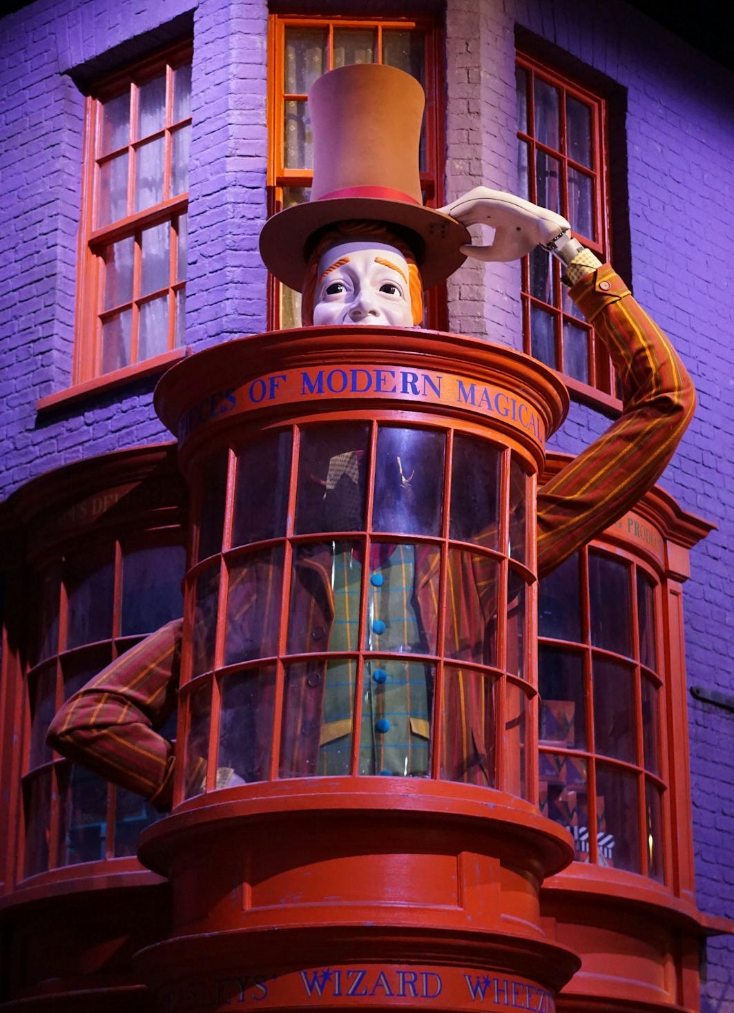 A tall building with a statue on top of it