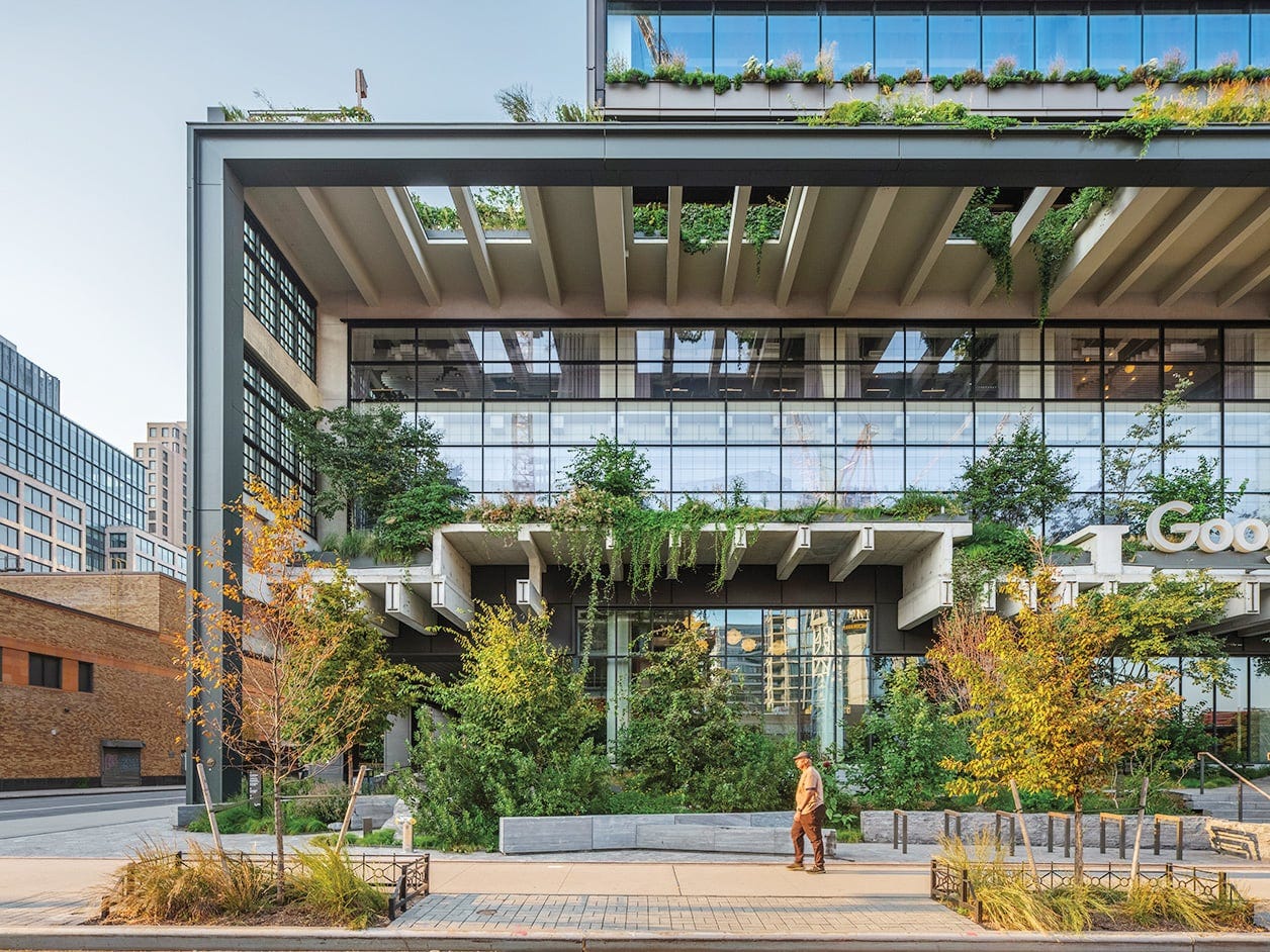 Exterior view of Google’s New York headquarters at St. John’s Terminal by COOKFOX, showing a restored historic structure topped with terraces filled with native trees and plants