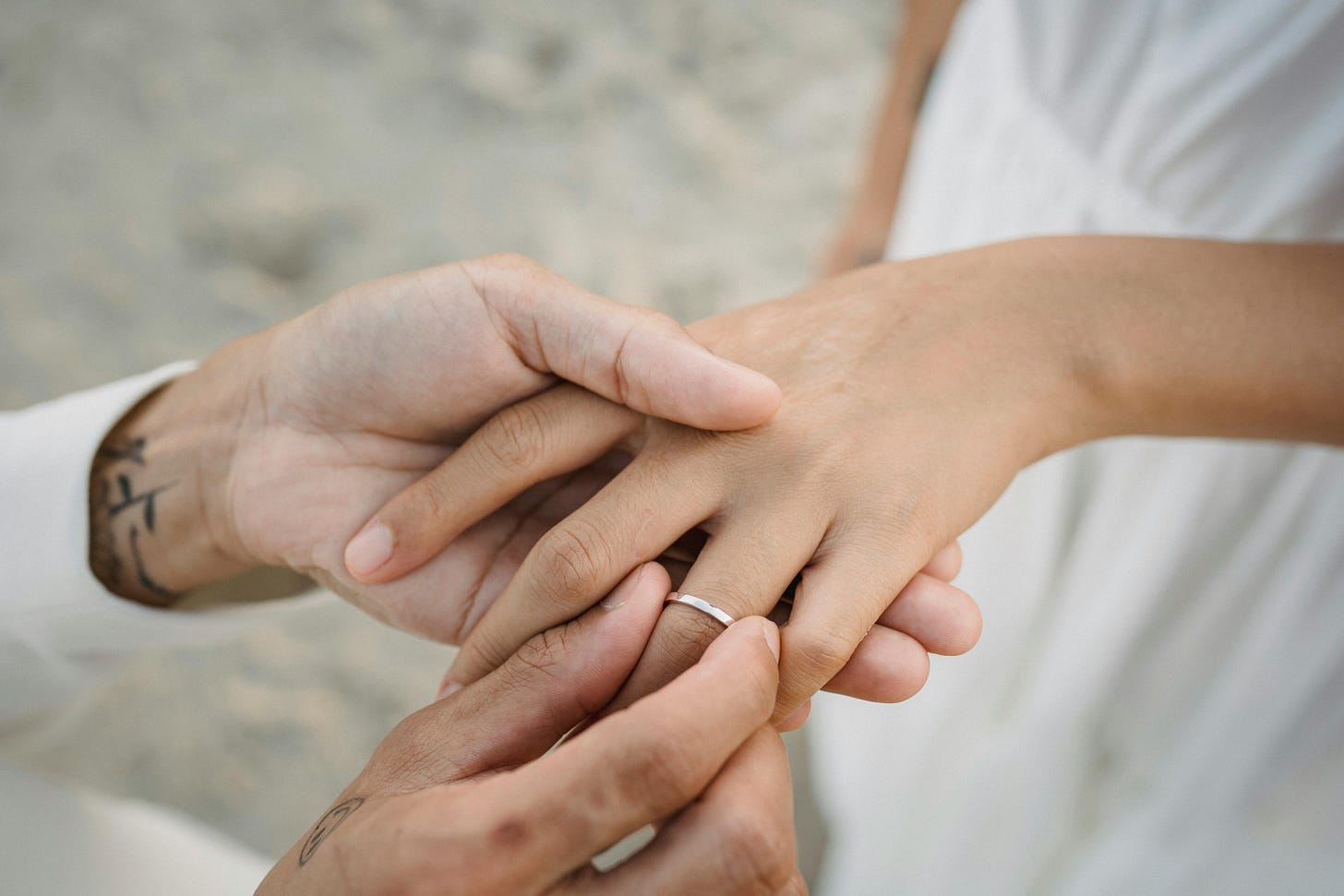 Close Up of Putting Wedding Ring on Finger · Free Stock Photo