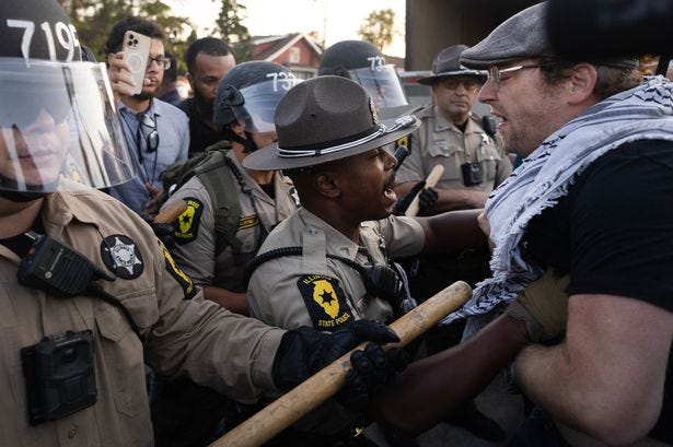 Police clash with demonstrators during a protest outside an immigrant processing and detention center on October 03, 2025 in Broadview, Illinois Police clash with demonstrators during a protest outside an immigrant processing and detention center on October 03, 2025 in Broadview, Illinois