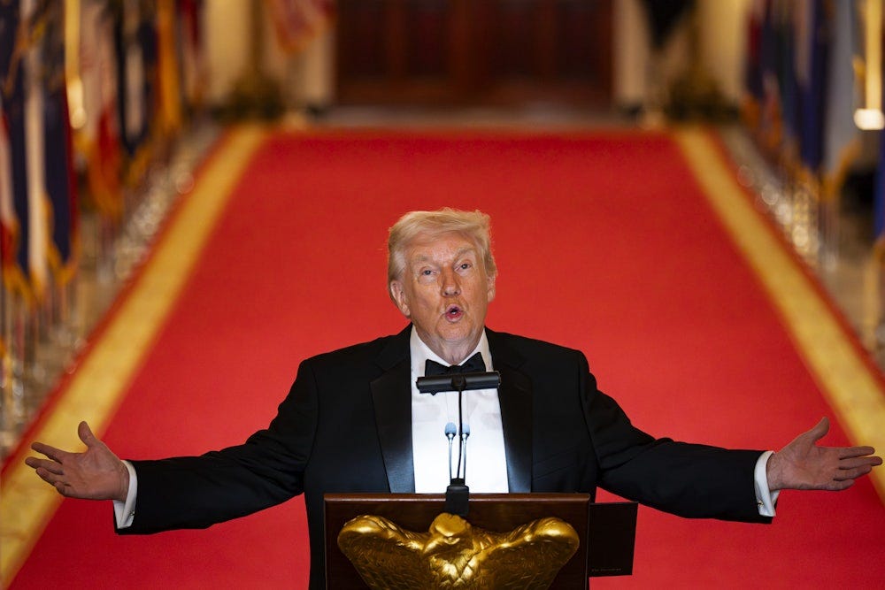 Donald Trump holds his arms out to the side and looks up while speaking at a podium Donald Trump holds his arms out to the side and looks up while speaking at a podium