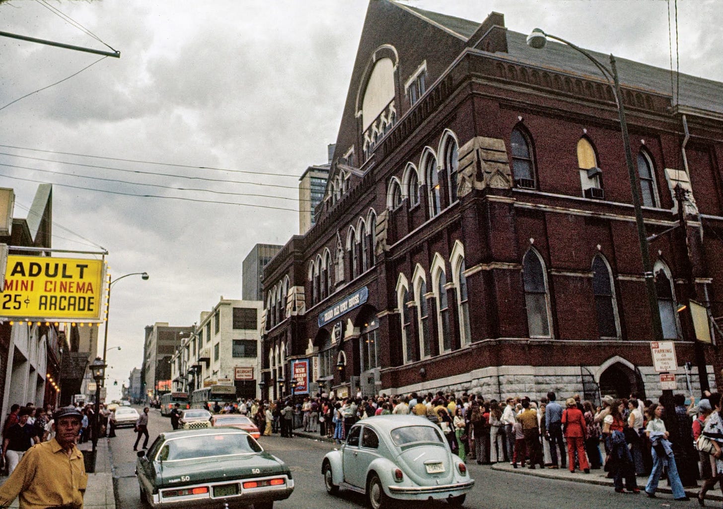 May be an image of street, crowd and text that says 'SAAA Mf ADULT MINI CINEMA CI 25& ARCADE MOHE 2999996 PAPRING a500 50 50 ESaa' May be an image of street, crowd and text that says 'SAAA Mf ADULT MINI CINEMA CI 25& ARCADE MOHE 2999996 PAPRING a500 50 50 ESaa'