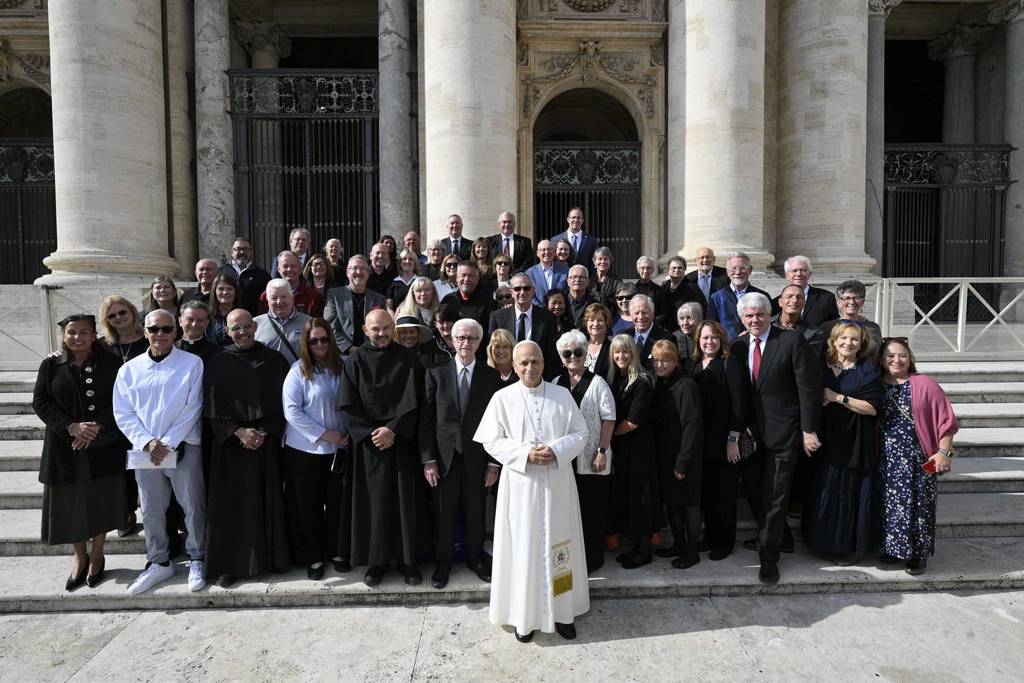 Pope Leo XIV with pilgrims from St. Jude Catholic Church in New Lenox, Illinois, in St. Peter’s Square