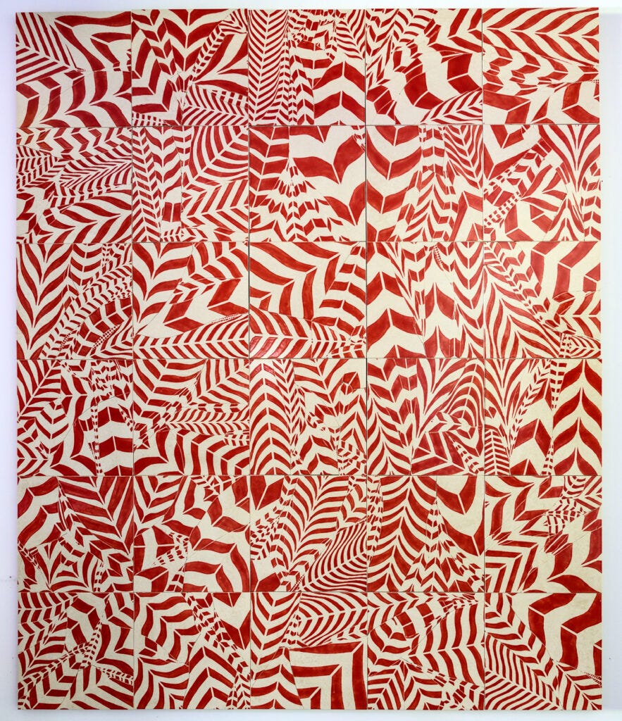 An abstract work in red and white on glazed tiles