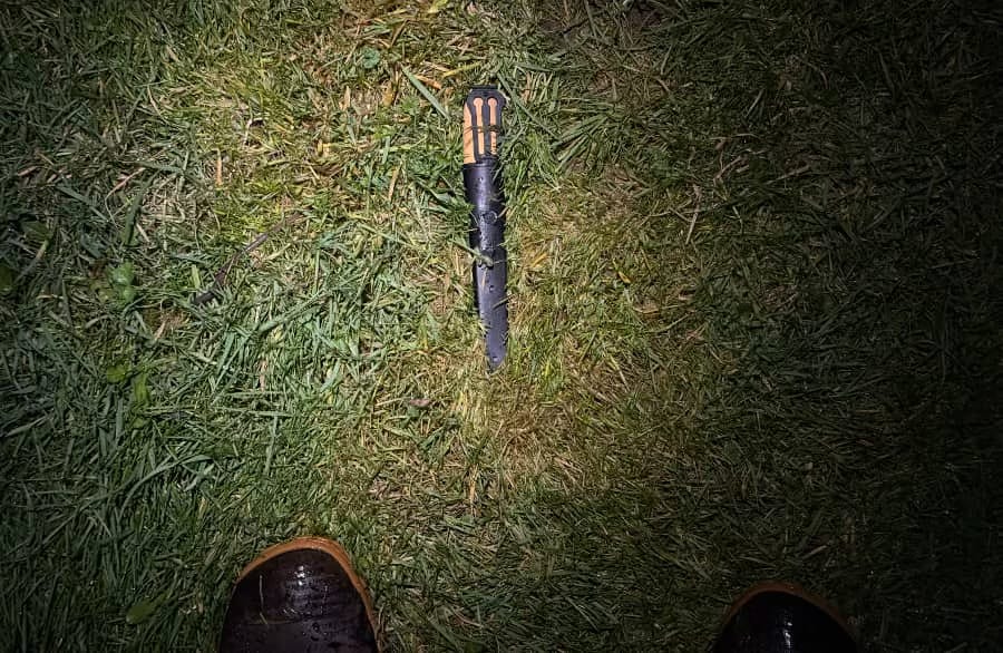 a photo of my knife lying in the grass a photo of my knife lying in the grass