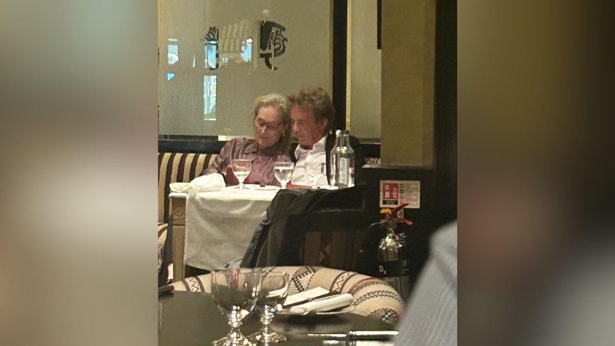 Image of Meryl Streep cuddled up to Martin Short at dinner. Image of Meryl Streep cuddled up to Martin Short at dinner.