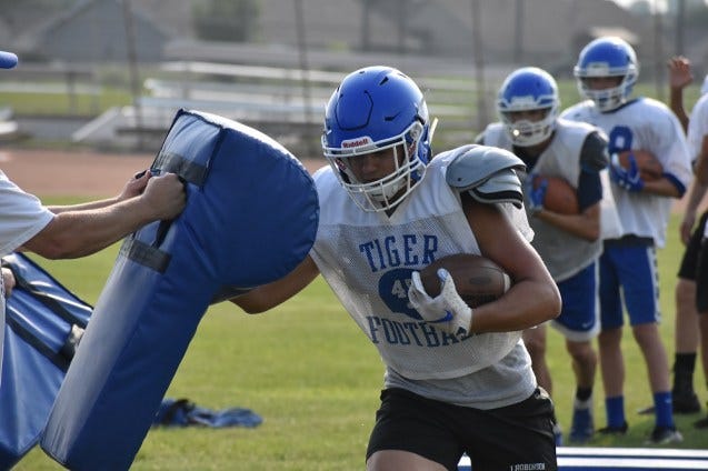 Wrightstown football player going through a drill. Wrightstown football player going through a drill.