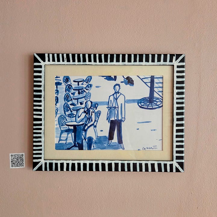 Framed art pieces in blue ink for sale. On a wall