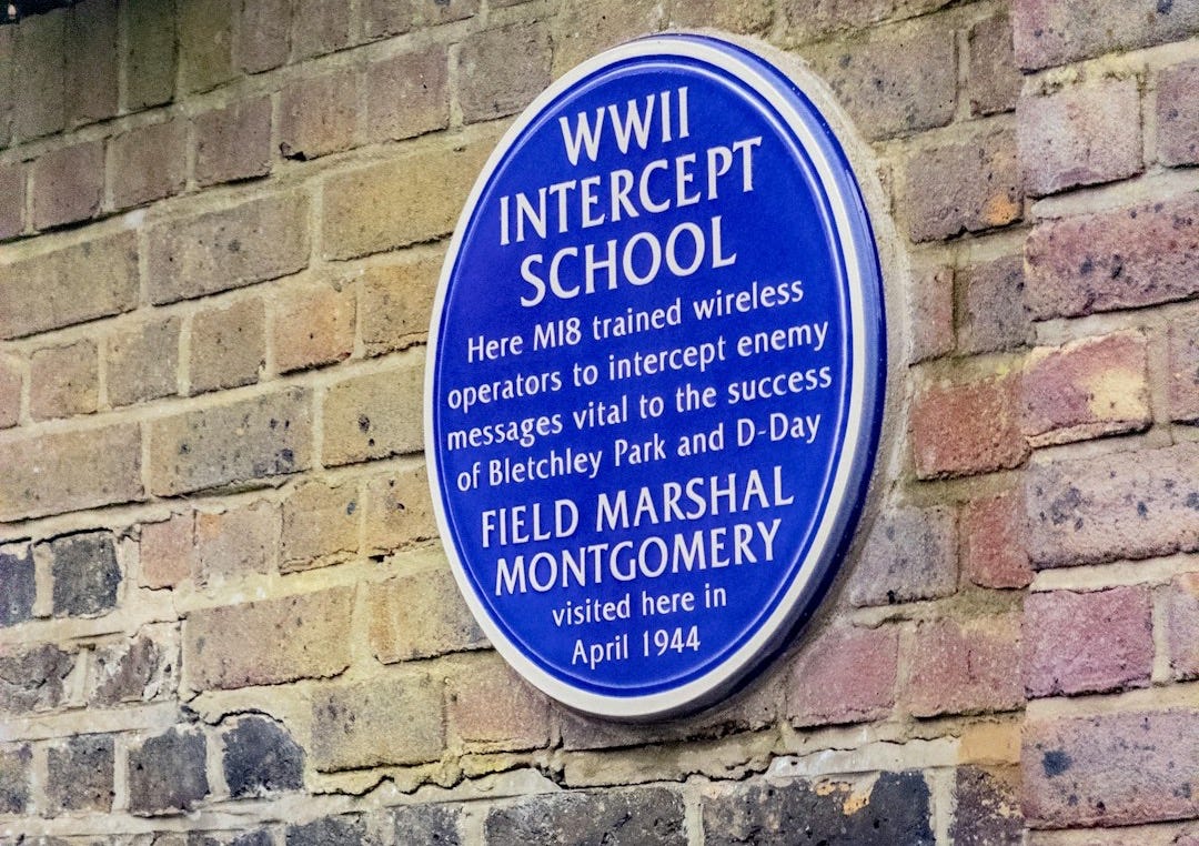 Wwii intercept school plaque on brick wall