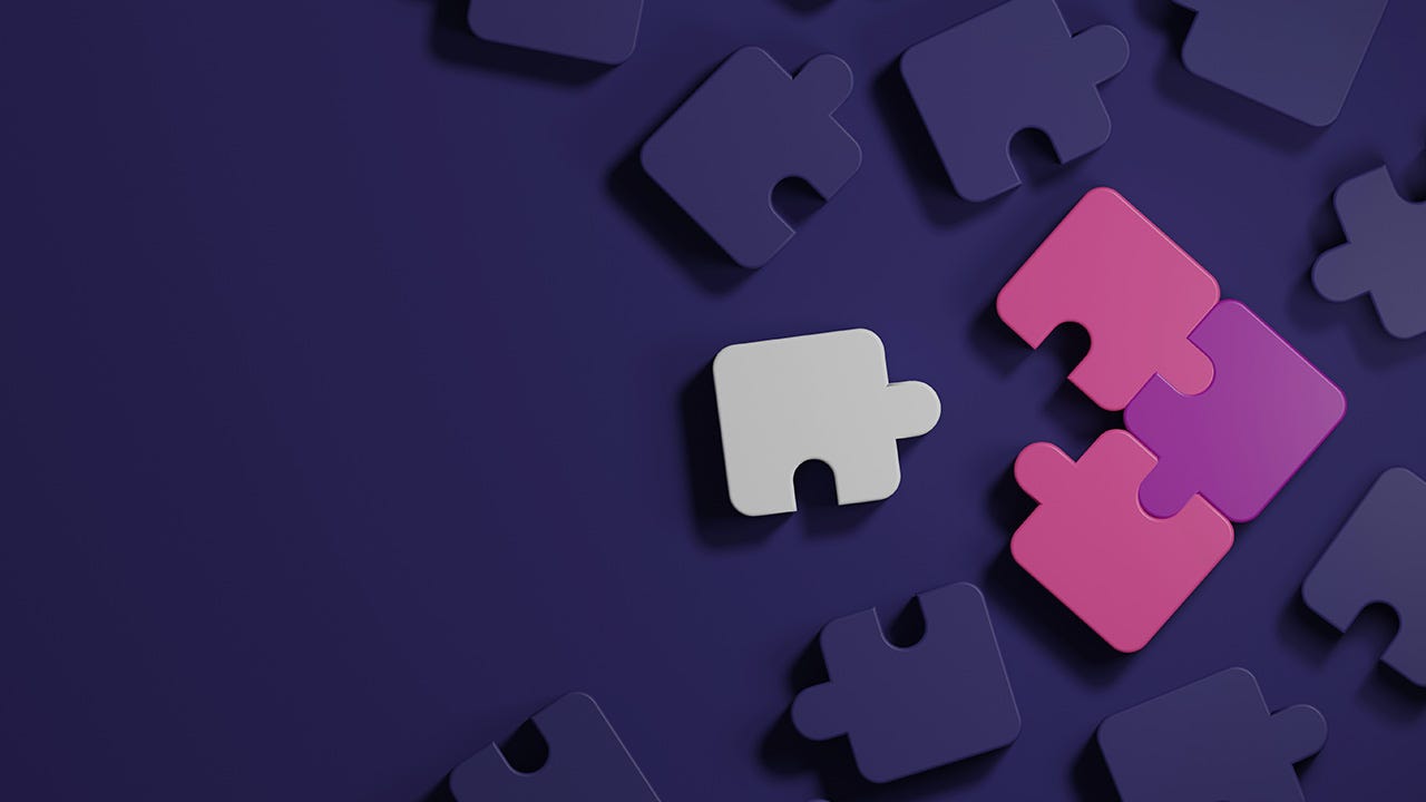 Connecting puzzle pieces together on a purple background