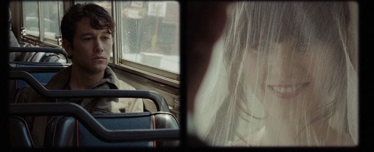 This may contain: a man and woman sitting on a bus together