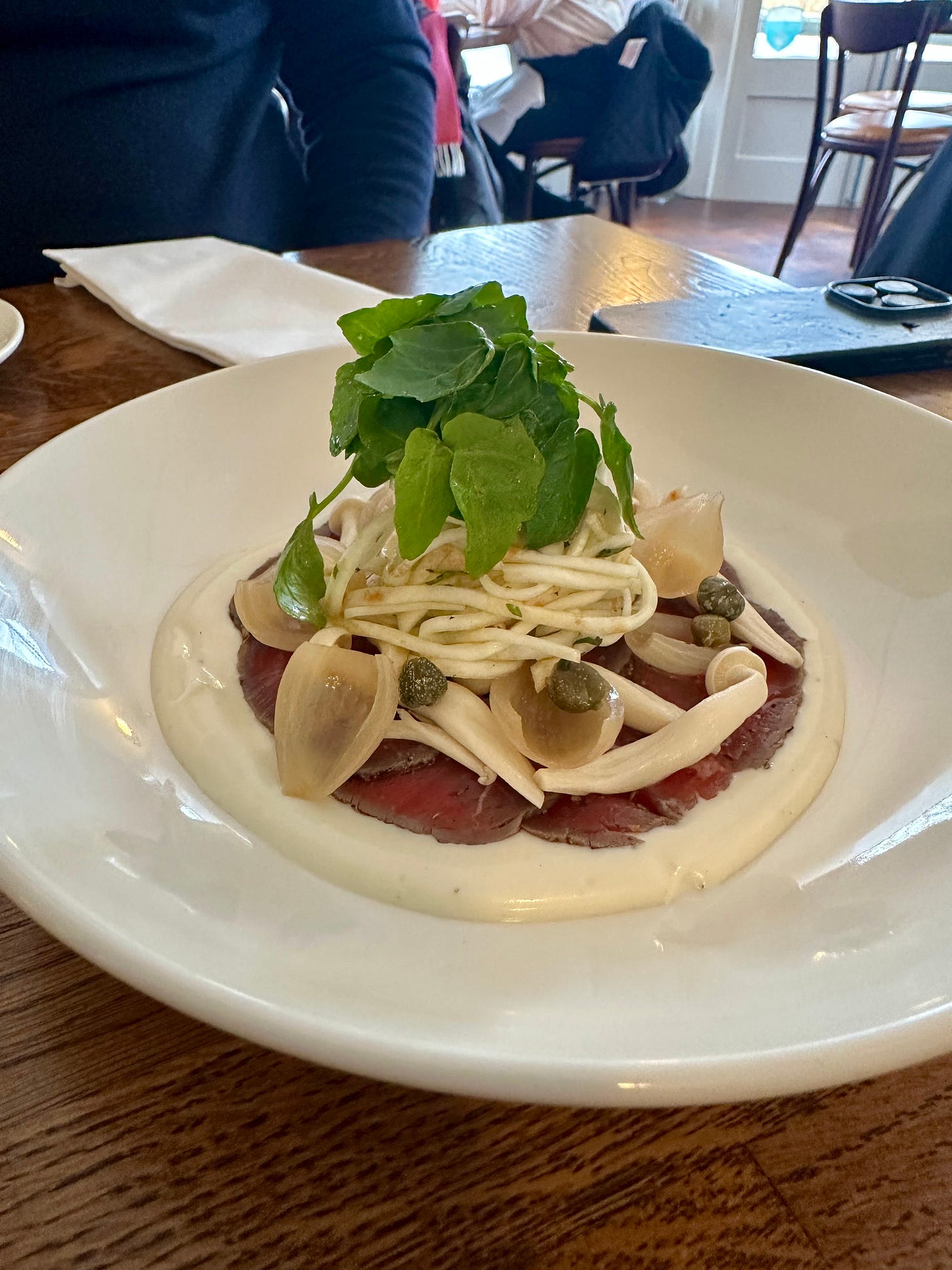 Spiced beef carpaccio with celeriac, pickled mushroom and gorgonzola at Lena