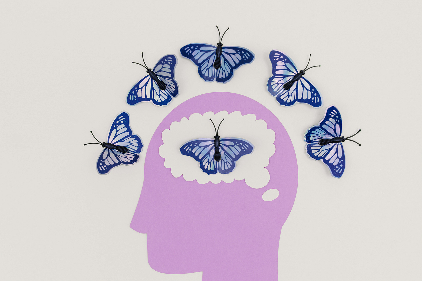 Drawing purple head blue butterflies in brain
