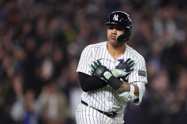 Gleyber Torres of the New York Yankees reacts while rounding the bases after hitting three-run home run during the eighth inning of Game Four of the...