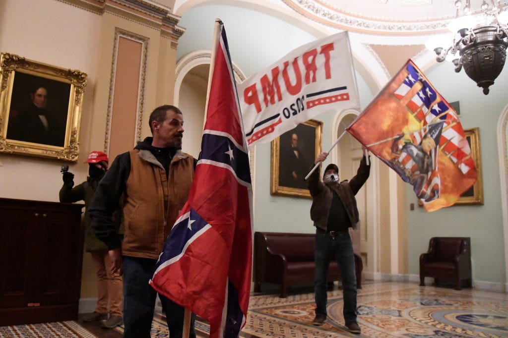 Jan. 6 participant who carried Confederate flag into Capitol begins trial |  PBS News