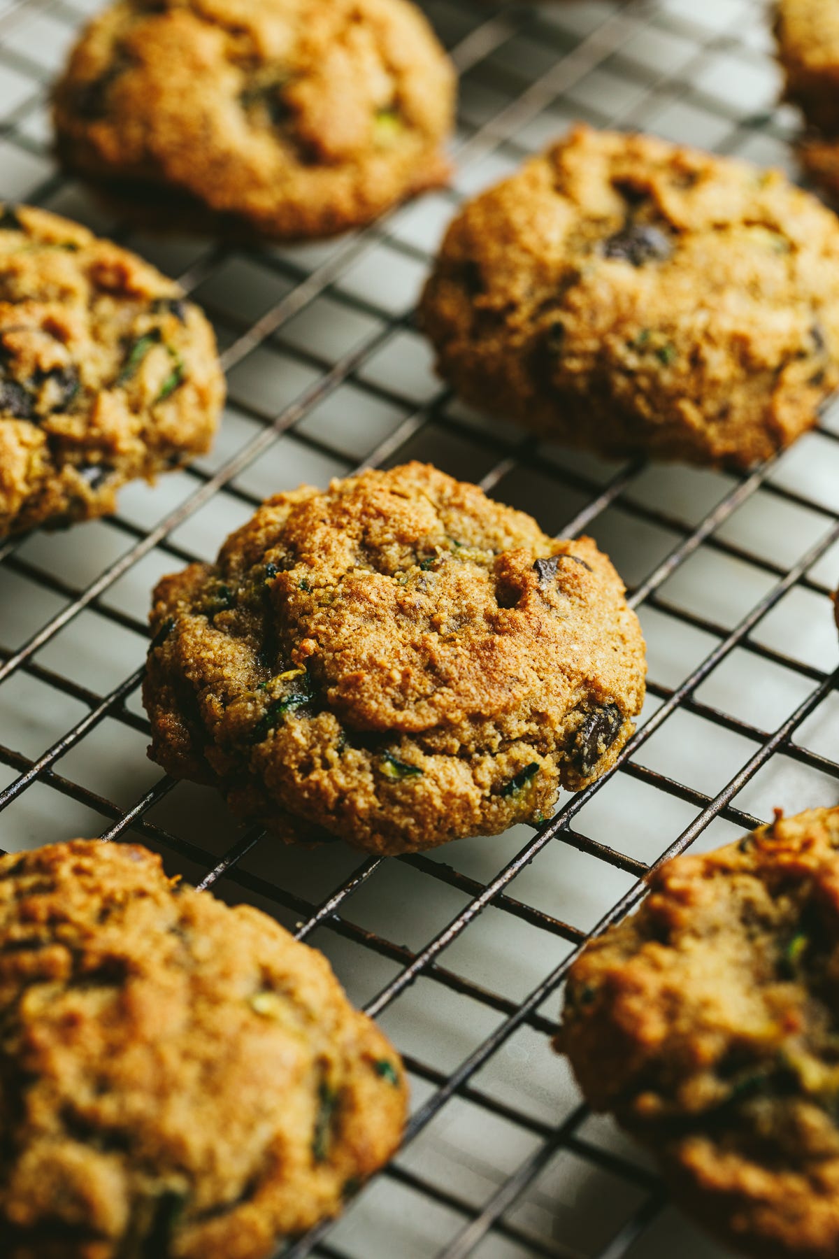 Brown butter zucchini cookies on a cooling rack.