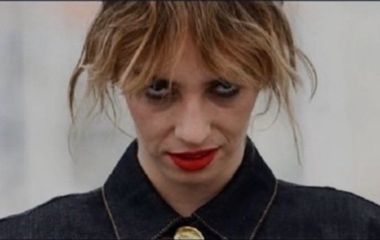 A person with red lipstick

Description automatically generated