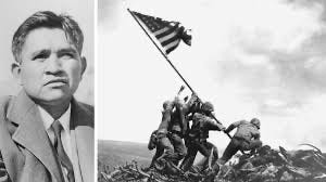 A child holding a flag with Iwo Jima in the background

AI-generated content may be incorrect.