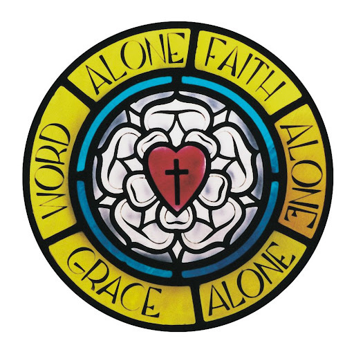 An image of a stained glass Luther rose with the text "Word Alone. Faith Alone. Grace Alone."