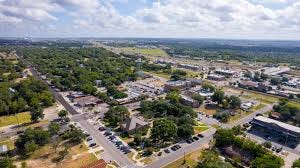 Aerial view of Kyle, Texas neighborhoods showing new construction and established homes in 2026. Aerial view of Kyle, Texas neighborhoods showing new construction and established homes in 2026.