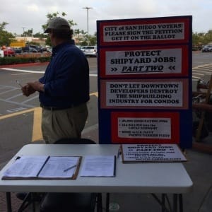 Signature gatherer outside Home Depot who turned his back on our photographer when asked if we could take his picture. 11/15/13.