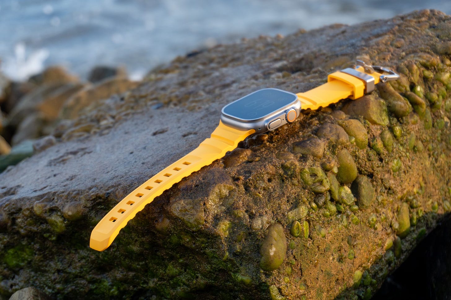 Nomad's Rocky Point band for Apple Watch Ultra in Soli on a rock.