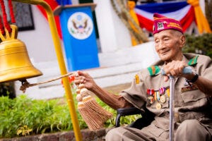 World War II Veteran Corporal Ernesto C. Luis Sr. ringing the ceremonial bell at 12:10 p.m., marking the exact minute of General Yamashita’s surrender to Filipino and American forces in 1945.
