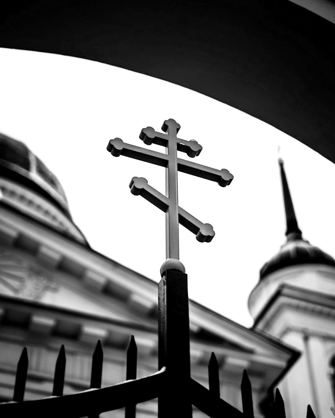 black cross on top of building