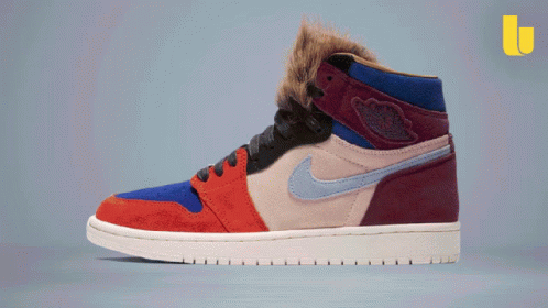 a pair of nike air jordans with a furry collar