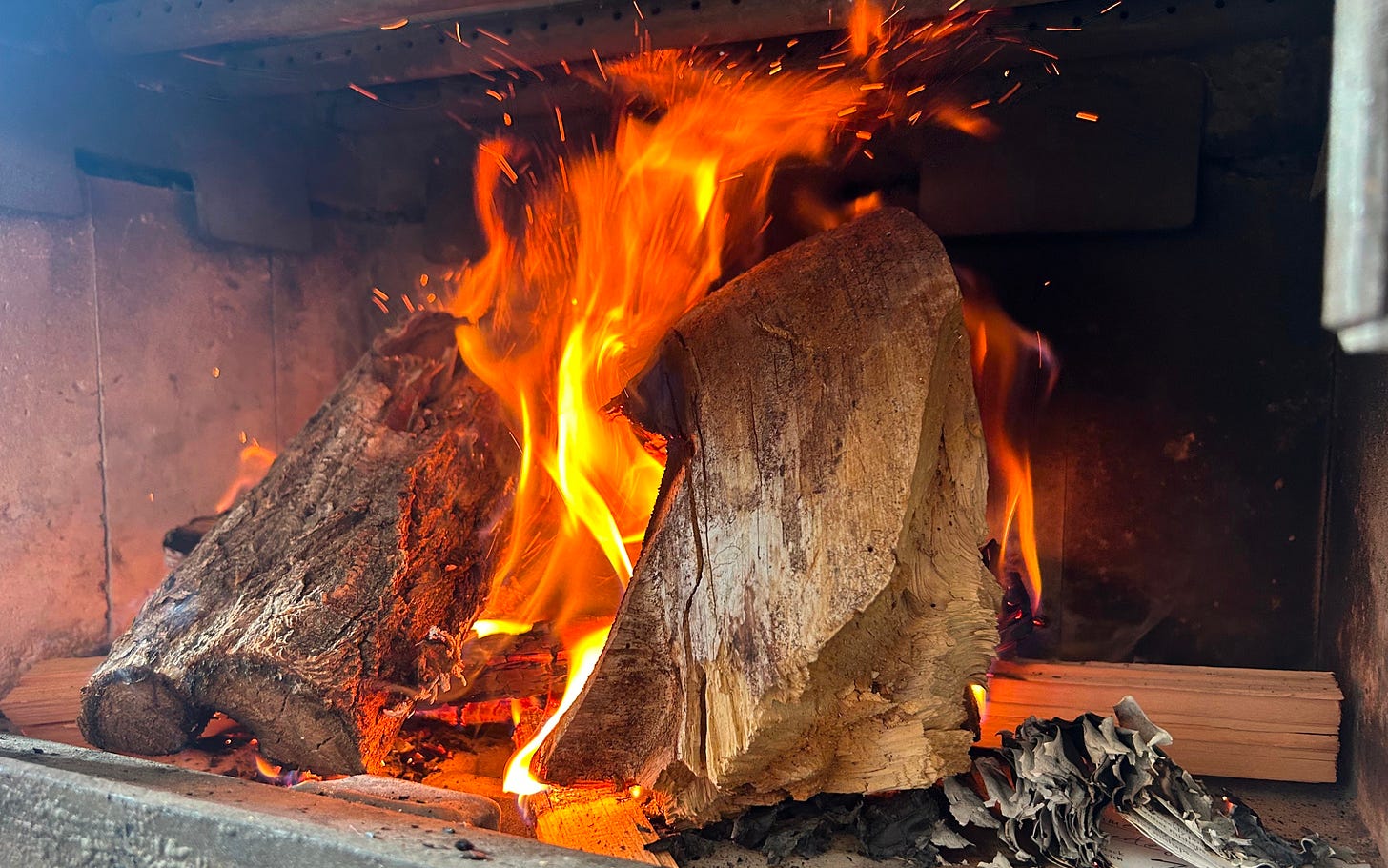 Wood-burning stove started with burned papers, pictured bottom right, which might as well be my magnum opus.