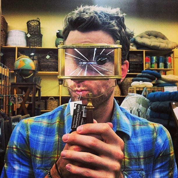 Tyler Knott Gregson looking through a magnifying glass Tyler Knott Gregson looking through a magnifying glass