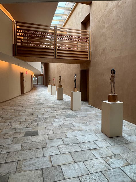 The library shelves are full of art books.