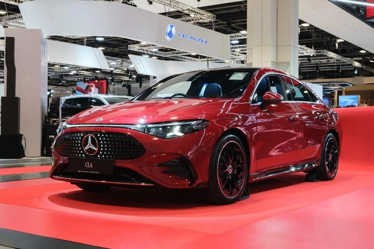 Electric and luxury vehicles displayed at Singapore Motorshow 2026, illustrating Southeast Asia’s shift toward electrification and software-driven mobility.