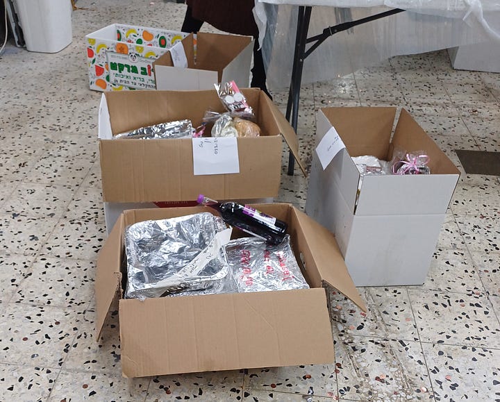 Boxes, table of wrapped food, Sabbath ritual items 