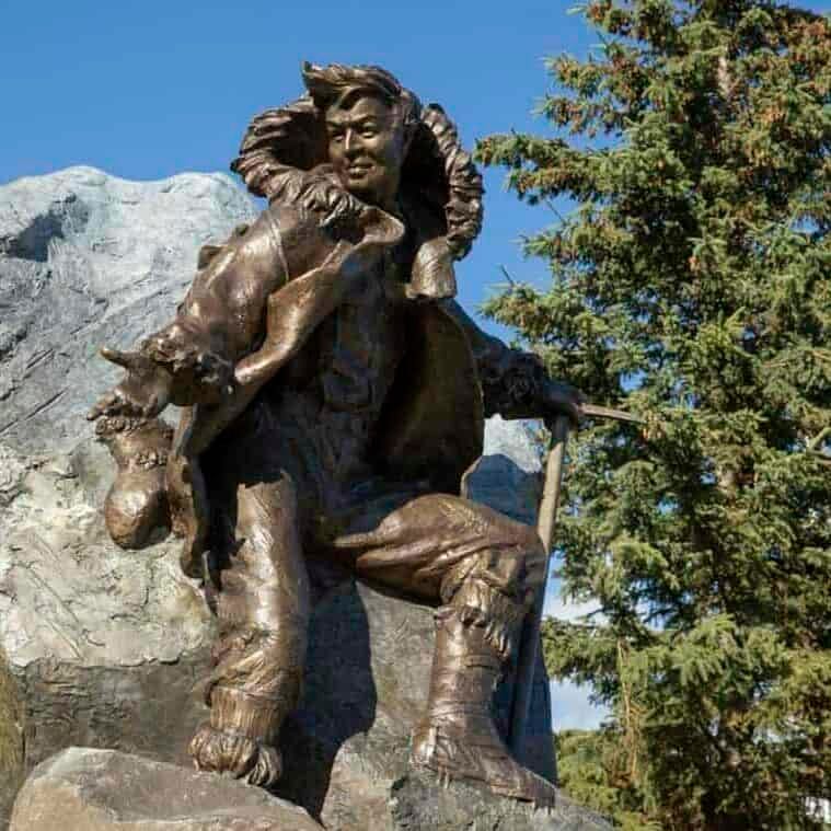 Bronze statue honoring Walter Harper, the first man to set foot on the summit of Mt. McKinley in Alaska, now on display in downtown Fairbanks, Alaska. Bronze statue honoring Walter Harper, the first man to set foot on the summit of Mt. McKinley in Alaska, now on display in downtown Fairbanks, Alaska.