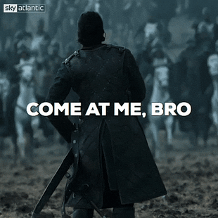A GIF of Jon Snow pulling out his sword on the battlefield with the text 'come at me bro'