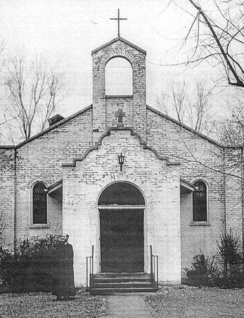 Father Francis J. Reilly stands in front of the county’s first Catholic Church built in 1929 on the corner of University and Lytle despite objections and a ‘torchlight march’ by the Ku Klux Klan.  This picture was taken in 1947, five years before the structure was sold and converted to a private residence.
