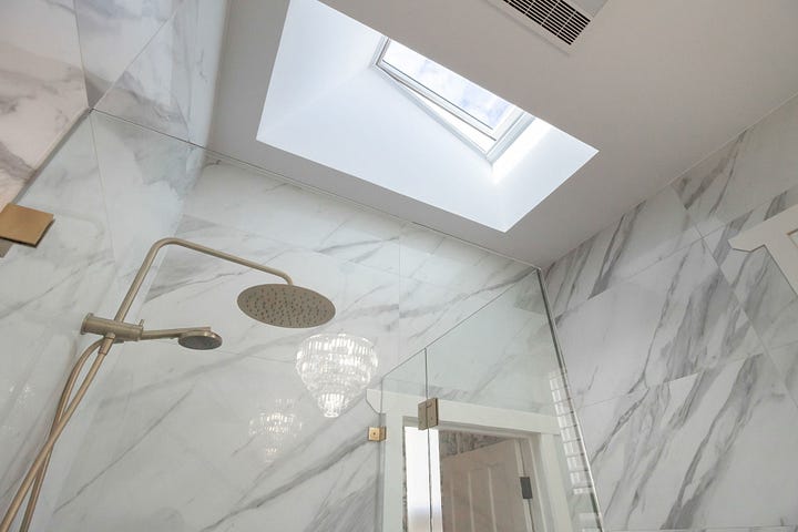 luxurious black and white ensuite bathroom designed by Plush Design Interiors and Penelope Herbert