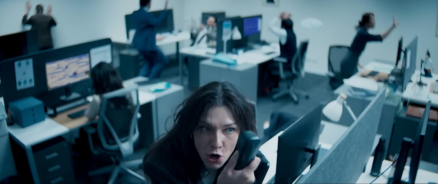 Chaotic office scene from the Beat IT Misery campaign video.