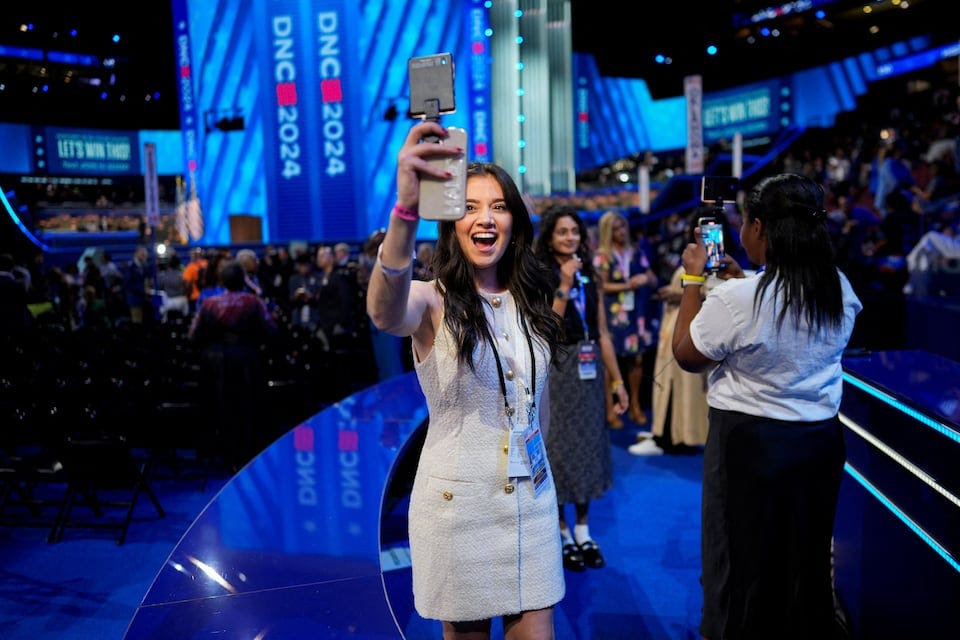At DNC, influencers battle journalists for space and access | Reuters